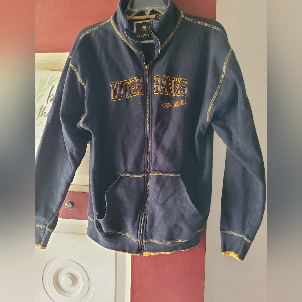 Unisex zip-up fitted sweater jacket.  Front pockets, raw edges.